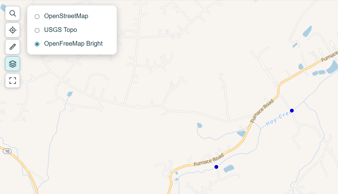 Layers menu showing OpenStreetMap, USGS Topo, and OpenFreeMap Bright selected over Hay Creek